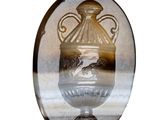 a glass vase with a picture of a horse in it