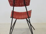 an image of a red chair with a basket on it