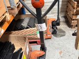 an image of a fork with a handle in a warehouse