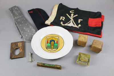 a white plate with a knife and other items on a table