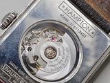 an image of a close up of a watch with a brown leather strap