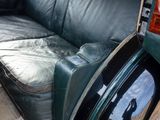 a couch that is sitting in the back of a car