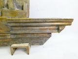 a small wooden bench sitting next to a fireplace