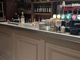 an image of a bar with stools in a restaurant