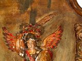 an image of a wooden plaque with an angel holding a sword