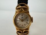 an image of a gold wrist watch with a black band