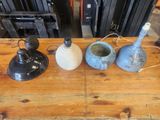 three vases sitting on a wooden table next to each other