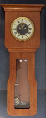 a wooden clock that is hanging on the wall
