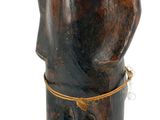 wooden statue of a man with a hat and tie around his neck
