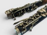 two clarinets that are sitting next to each other