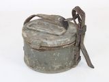 a small metal container with a handle on it