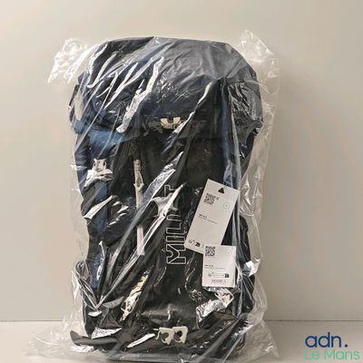 a bag of clothing wrapped in plastic on a table