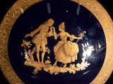 a plate with a picture of a man and a woman on it