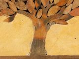 a picture of a tree made out of leaves on a wall