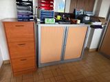 a filing cabinet in the corner of a room