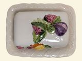 a plate with a figurine on it on a table