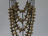 a sculpture of some kind of bird on a stand
