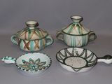 three bowls and a bowl with a spoon in it
