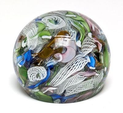 a glass ball with a lot of different things inside of it
