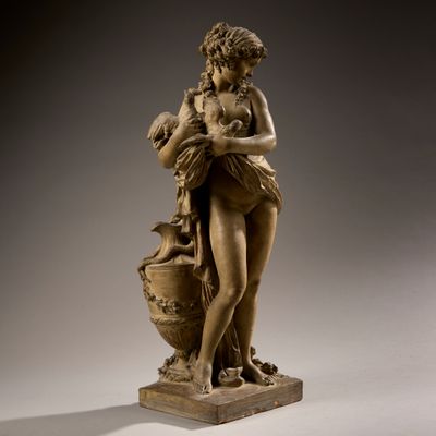 statue of a woman holding a vase and a baby