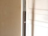 an image of a floor lamp in the corner of a room