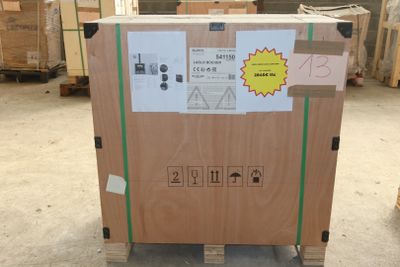 a large cardboard box on a pallet in a warehouse