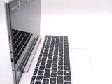 two laptops sitting side by side on a white surface