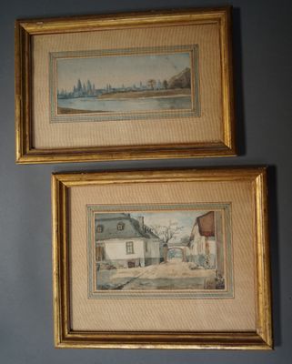 two framed paintings on a wall of a house and a street