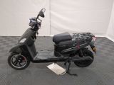 an image of a scooter parked on a checkered floor