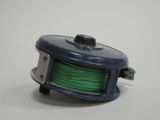 a blue reel with a green spool on it