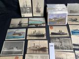 a lot of old postcards of ships on a table