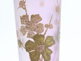 a purple vase with a gold leaf design on it