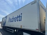 a semi truck that is parked on the side of the road