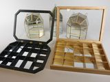 two boxes that have mirrors in them on a table