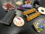 many different types of brooches on a table