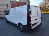 a white van that is parked in a parking lot