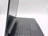 a black laptop with a black keyboard on a white surface