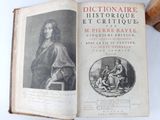 an old book with a picture of a man and a woman on it