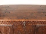 an old wooden chest sitting in a corner of a room