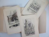 several drawings of buildings and buildings are on a table