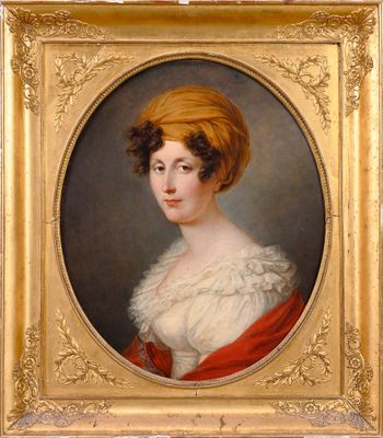 portrait of a woman in a turban by a gold frame