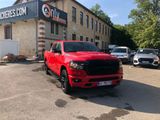 a red truck parked in front of a building