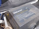 a car battery that is in the trunk of a car