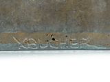 a metal container that has some writing on it