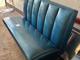 a blue bench that is sitting in a room