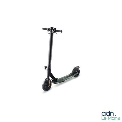 a scooter that is sitting on a white surface