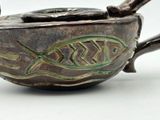 a brown bowl with a fish design on it