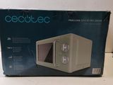 box of a microwave sitting on a counter top with the box open