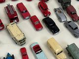 a lot of toy cars that are on the table
