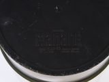 a black lid on a black container on a white table